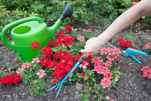 Landscape gardening in Friern Barnet with a stylish patio and planting beds